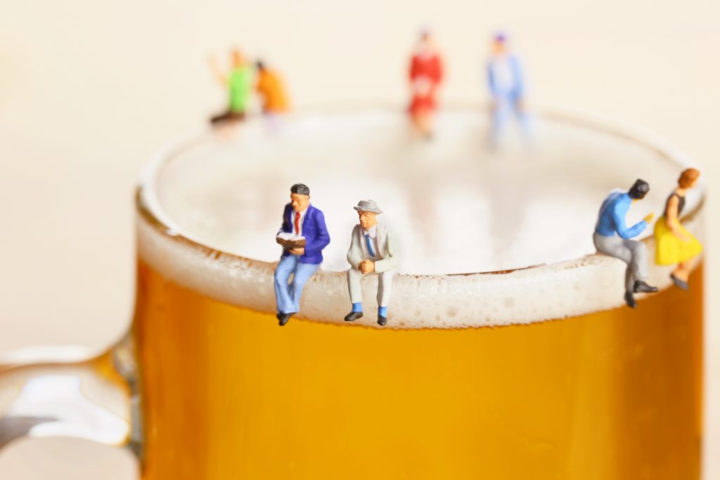 work colleagues sitting on a beer