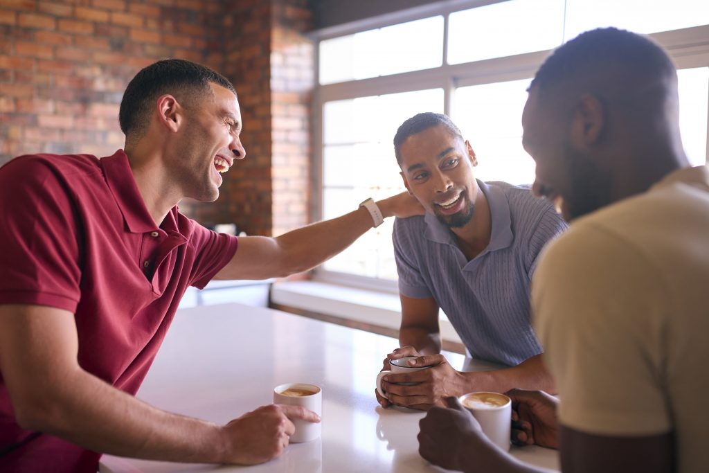 three men at a meeting